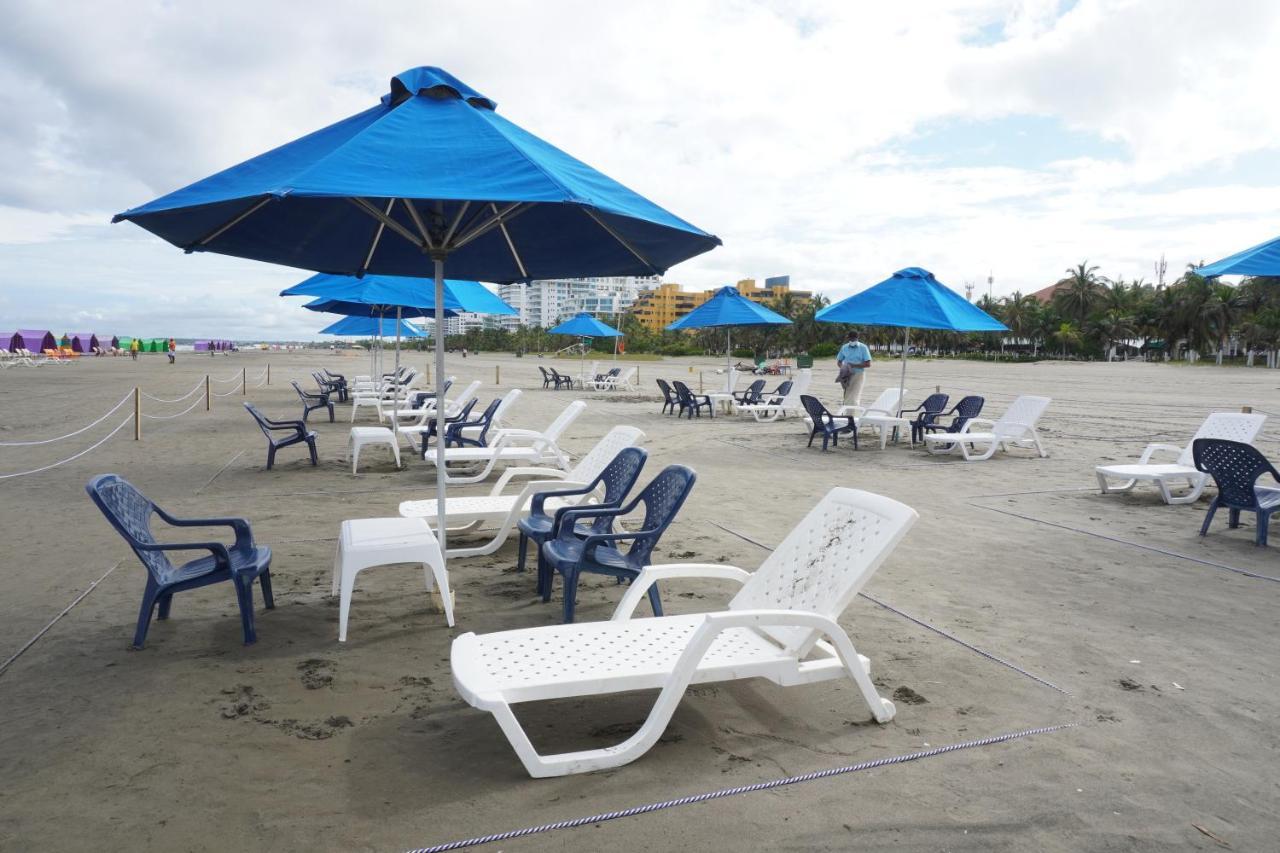 Hotel Las Americas Casa De Playa Cartagena Exterior photo Beach chairs and umbrellas at South Beach, Miami